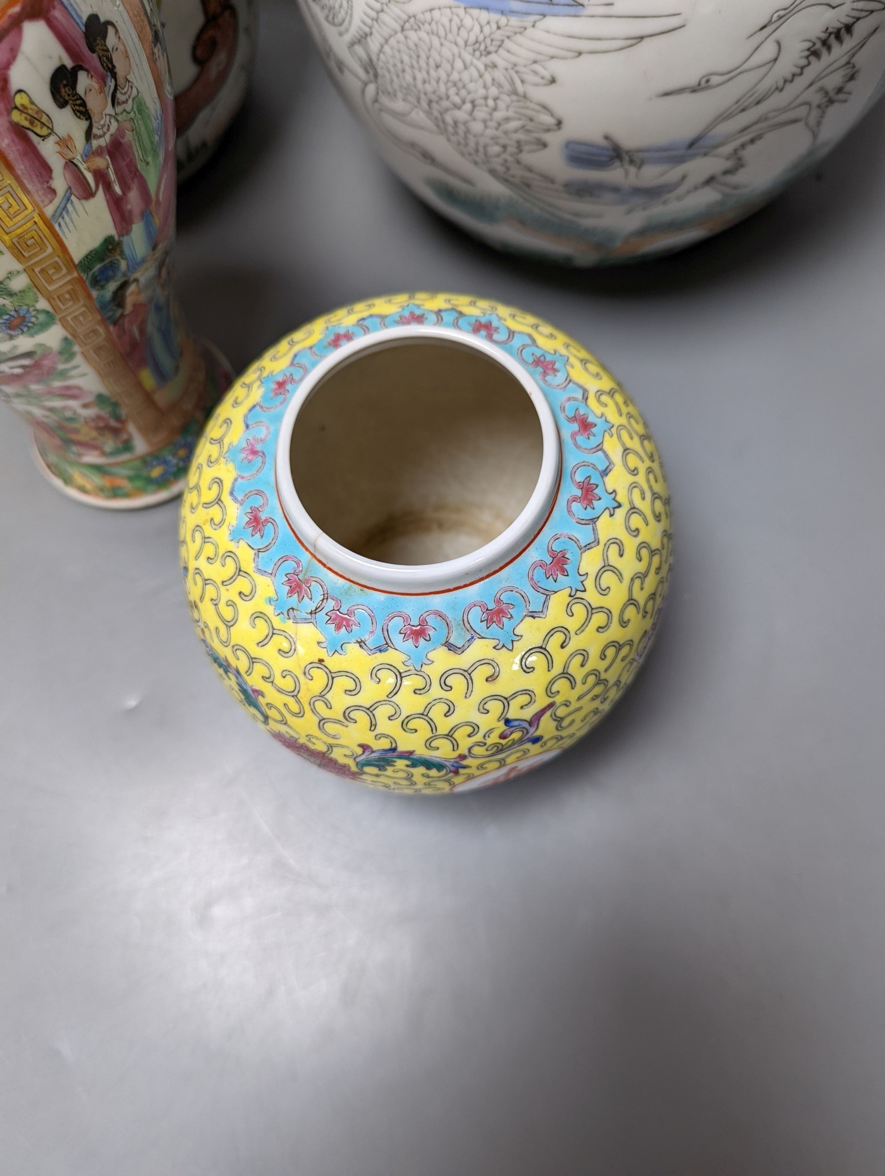 A Chinese famille rose vase and two ginger jars, together with a Japanese vase, 38cm